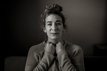 black and white portrait of woman looking fearful something bad will happen